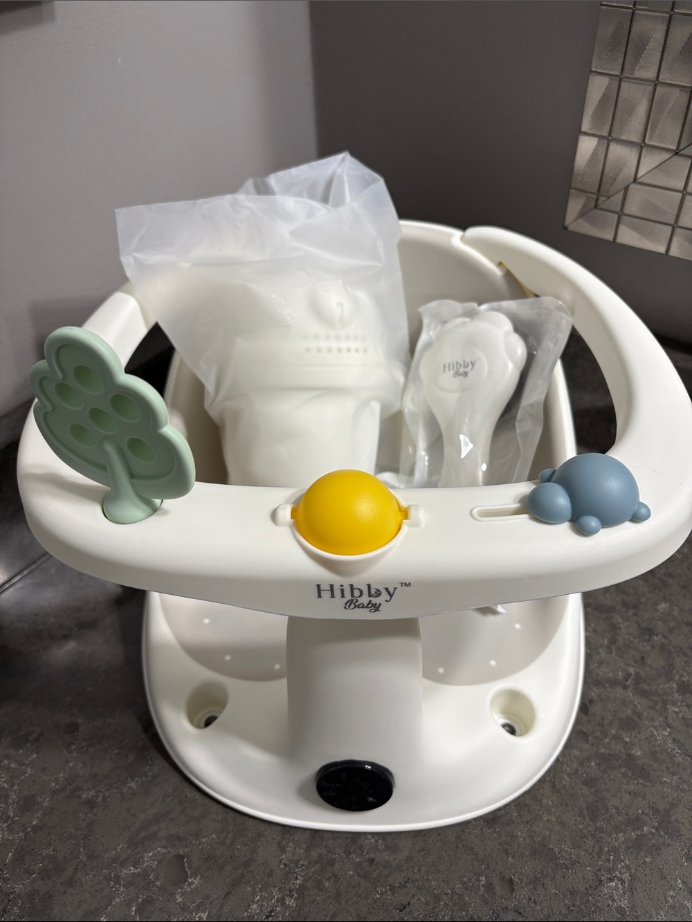 Hibby Baby Infant Bath Seat with Yellow, Green & Blue Toy Accents.